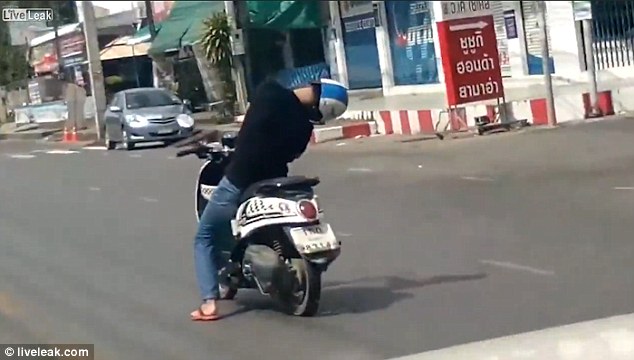 The video was captured by a motorist, who was travelling behind the man as he rode from left to right