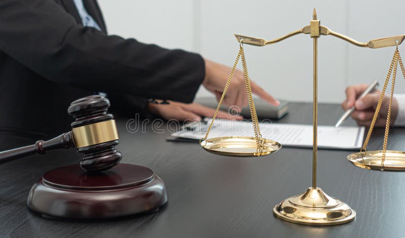 Judge or lawyer has explained and calculated the law to the client to sign the document as important evidence in the case of fraud. And not receiving fair royalty free stock image