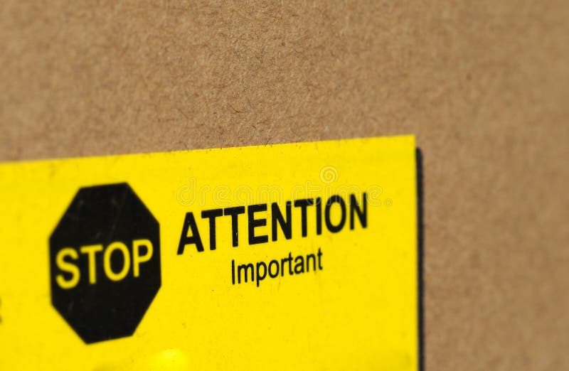 Stop attention important sign. Stop attention important warning sign in black and yellow on packet royalty free stock images