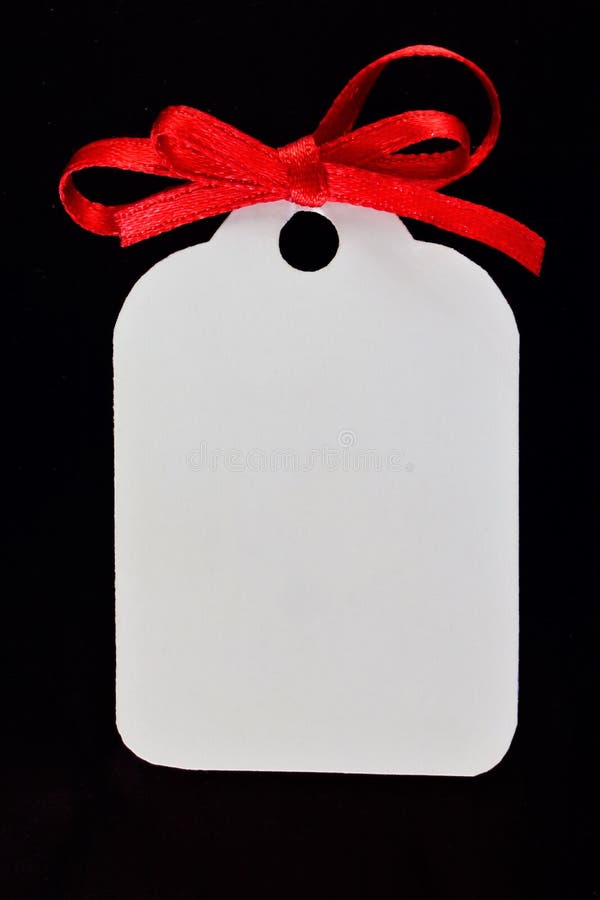 The tag is white on a black background with red bow. Label frame to indicate important text, picture, price or sign - black Friday. Sale, Christmas gift stock photography