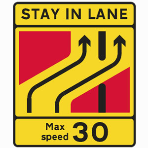 Traffic lanes separate advised speed limit sign