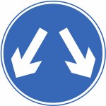 Vehicles may pass either side to reach the same destination sign